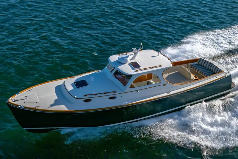 Slide: The Image of 2001 Hinckley Picnic Boat 36 Classic cruising on open water. - 11