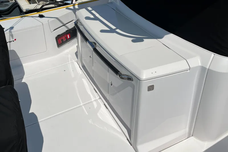 Slide: The Image of 2020 Axopar 37 XC boat deck with storage compartments. - 30