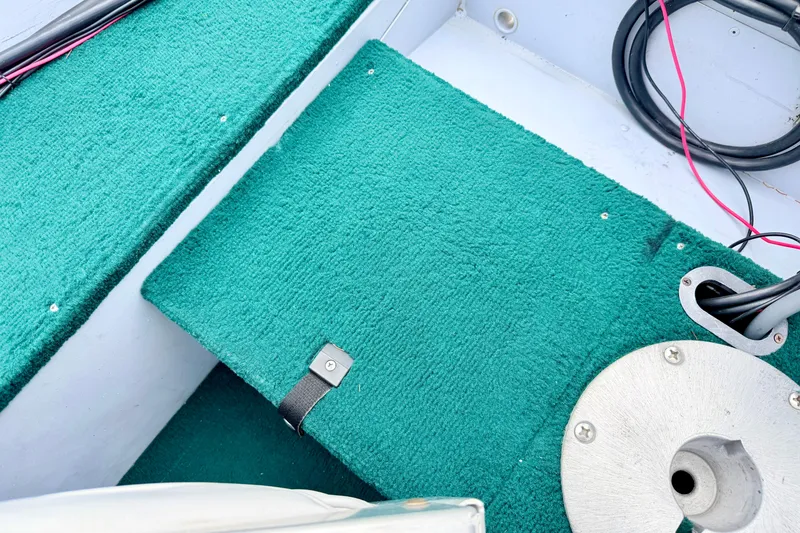 Slide: The Image of Interior of 2002 Lund 1650 Rebel SS boat with green carpet and wiring. - 31