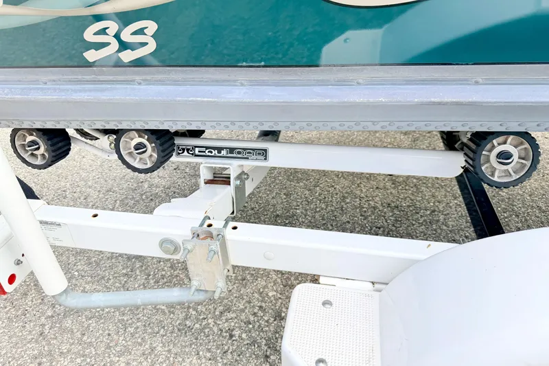 Slide: The Image of Trailer detail of a 2002 Lund 1650 Rebel SS boat with EquiLoad system. - 67