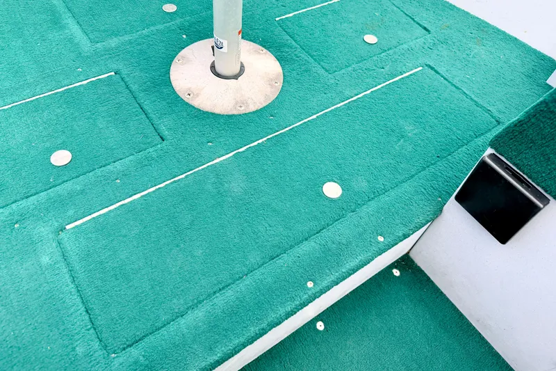 Slide: The Image of Green carpeted deck of a 2002 Lund 1650 Rebel SS boat. - 39