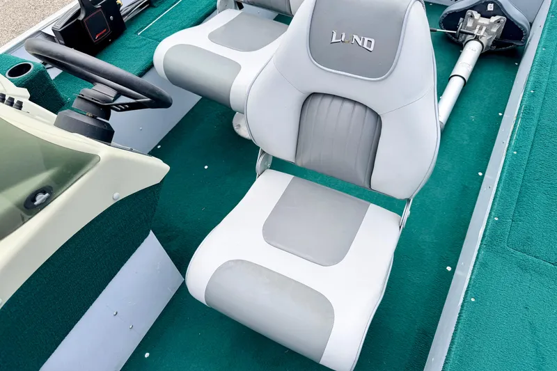 Slide: The Image of 2002 Lund 1650 Rebel SS boat interior with gray and white seating. - 36