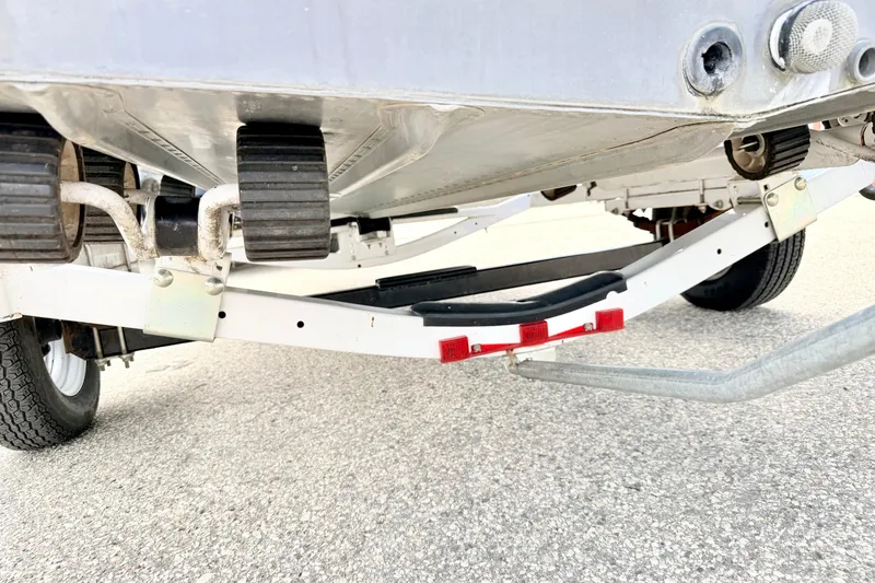 Slide: The Image of Underside view of a 2002 Lund 1650 Rebel SS boat on a trailer. - 65