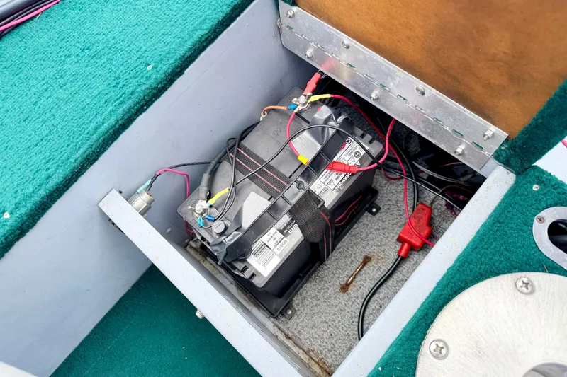 Slide: The Image of Battery compartment of a 2002 Lund 1650 Rebel SS boat with wiring connections. - 32
