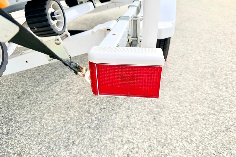 Slide: The Image of Trailer light on a 2002 Lund 1650 Rebel SS boat trailer, close-up view. - 66