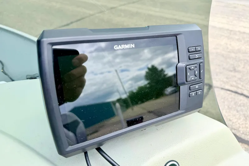 Slide: The Image of Garmin GPS device on 2002 Lund 1650 Rebel SS boat dashboard. - 21