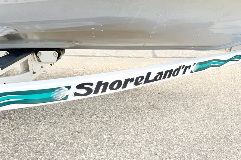 Slide: The Image of ShoreLand'r trailer with 2002 Lund 1650 Rebel SS boat on pavement. - 69