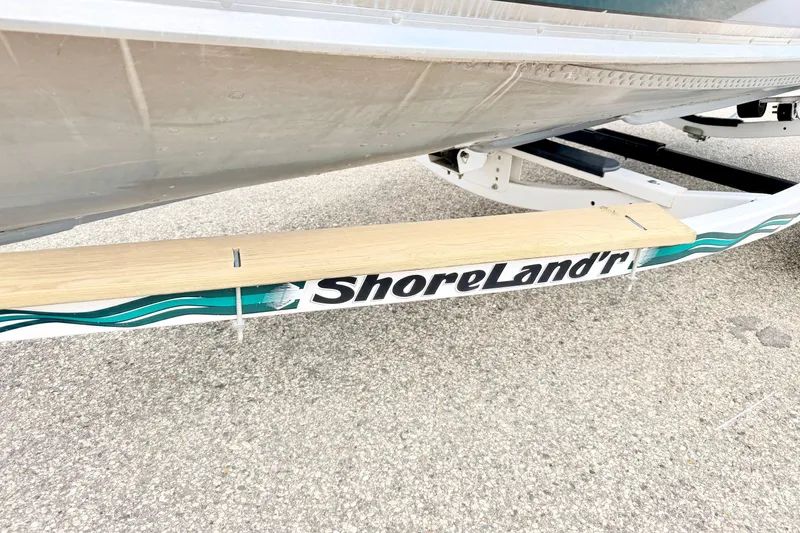 Slide: The Image of 2002 Lund 1650 Rebel SS boat on ShoreLand'r trailer, close-up view. - 61
