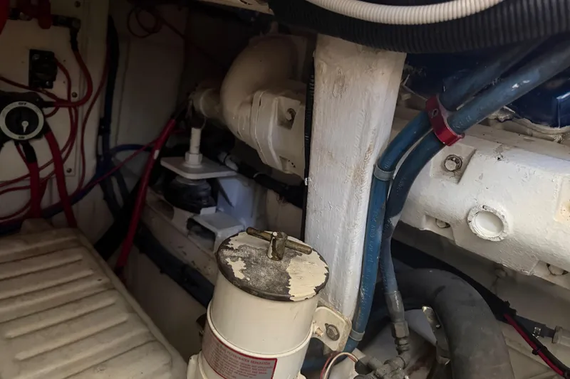 Slide: The Image of Engine room of 2000 Cabo 35 Flybridge with visible wiring and components. - 97