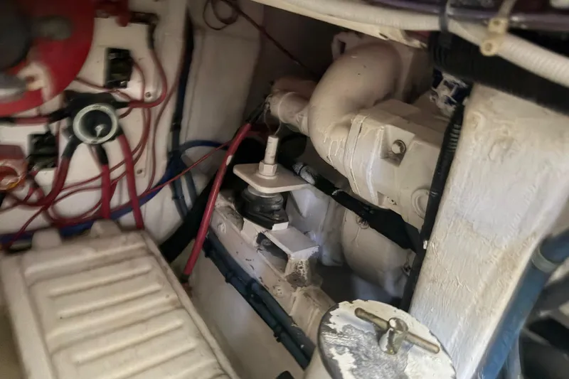 Slide: The Image of Engine room of 2000 Cabo 35 Flybridge with wiring and mechanical components. - 96