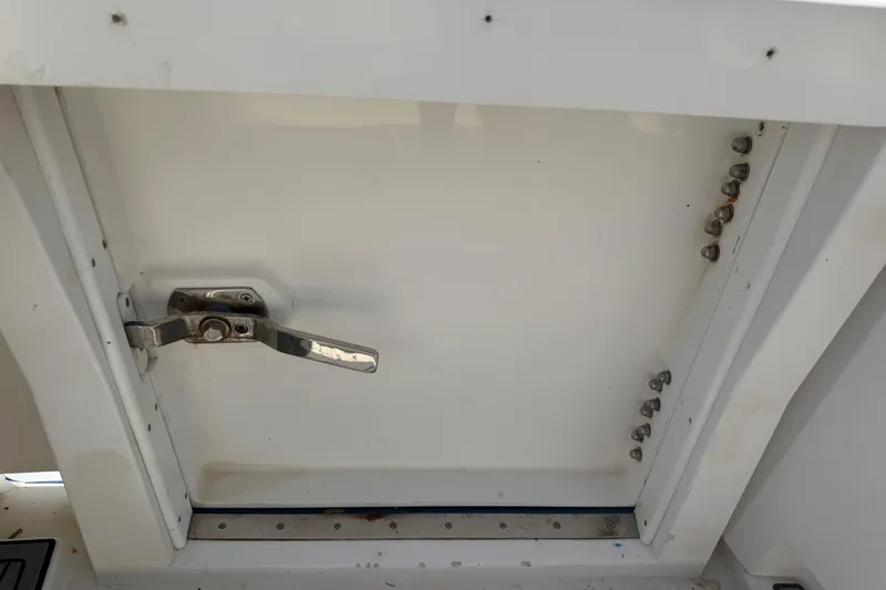 Slide: The Image of Hatch door with metal latch on 2000 Cabo 35 Flybridge boat. - 27