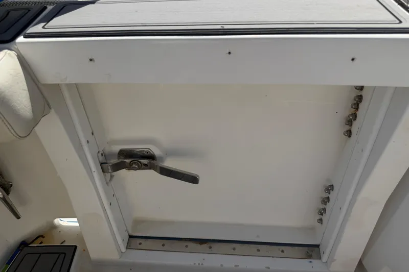 Slide: The Image of Hatch door with handle on a 2000 Cabo 35 Flybridge boat. - 47