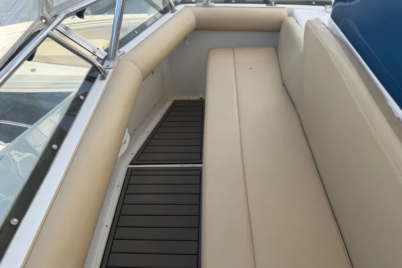 Slide: The Image of Cabo 35 Flybridge 2000 boat interior with beige seating and sleek flooring. - 19
