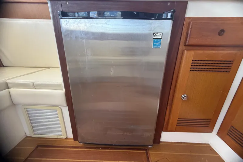 Slide: The Image of Stainless steel refrigerator in 2000 Cabo 35 Flybridge boat interior. - 59
