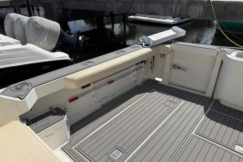 Slide: The Image of Spacious deck of a 2000 Cabo 35 Flybridge boat, featuring modern fittings and storage. - 45