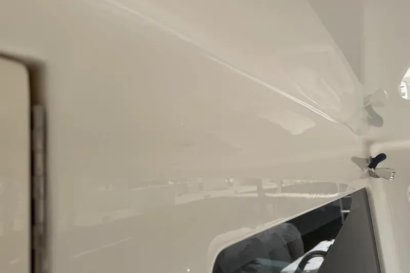 Slide: The Image of Close-up of a 2000 Cabo 35 Flybridge boat exterior, showcasing sleek design details. - 38