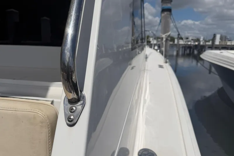 Slide: The Image of Cabo 35 Flybridge 2000 boat side view with railing, docked at marina. - 28