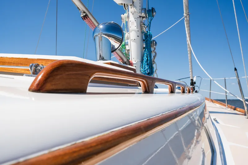 Slide: The Image of Close-up of 1985 Hinckley Sou'wester 51 yacht deck with polished wood details. - 59