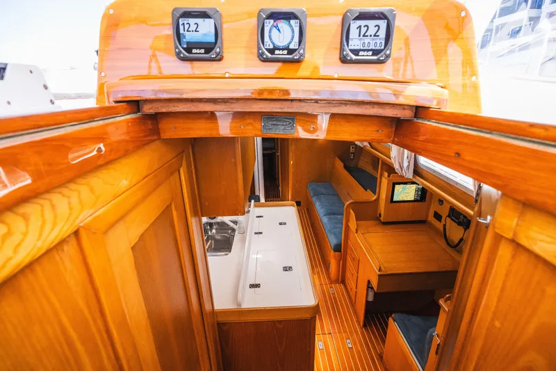 Slide: The Image of Interior of 1985 Hinckley Sou'wester 51 sailboat with wooden finish and navigation instruments. - 8