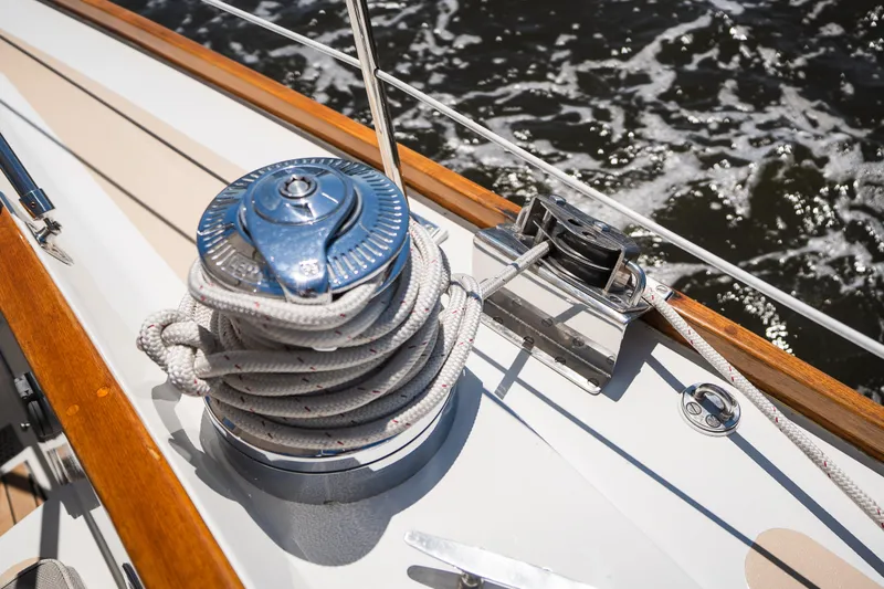 Slide: The Image of Winch and ropes on 1985 Hinckley Sou'wester 51 sailboat deck. - 54