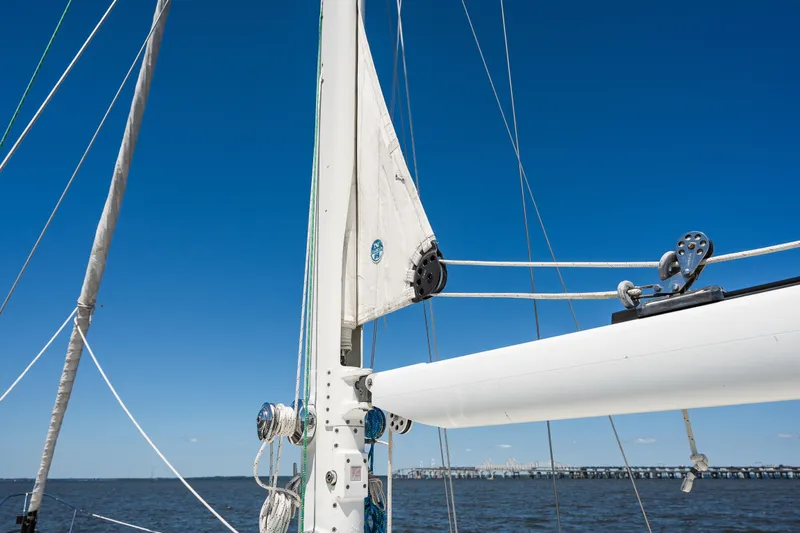 Slide: The Image of Hinckley Sou'wester 51 sailboat mast and rigging against clear blue sky, 1985 model. - 41