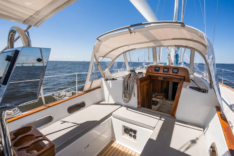 Slide: The Image of Hinckley Sou'wester 51 sailboat cockpit, 1985 model, with ocean view and clear blue sky. - 7