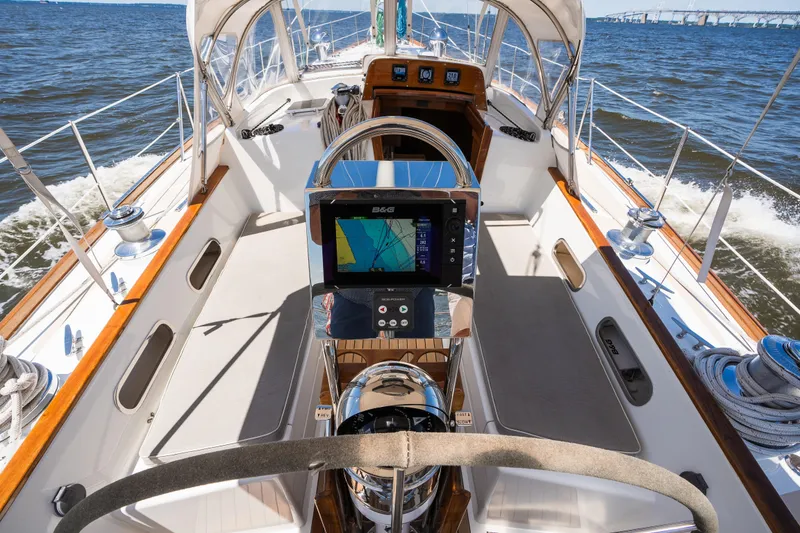 Slide: The Image of Hinckley Sou'wester 51 sailboat cockpit with navigation system, cruising on open water. - 6