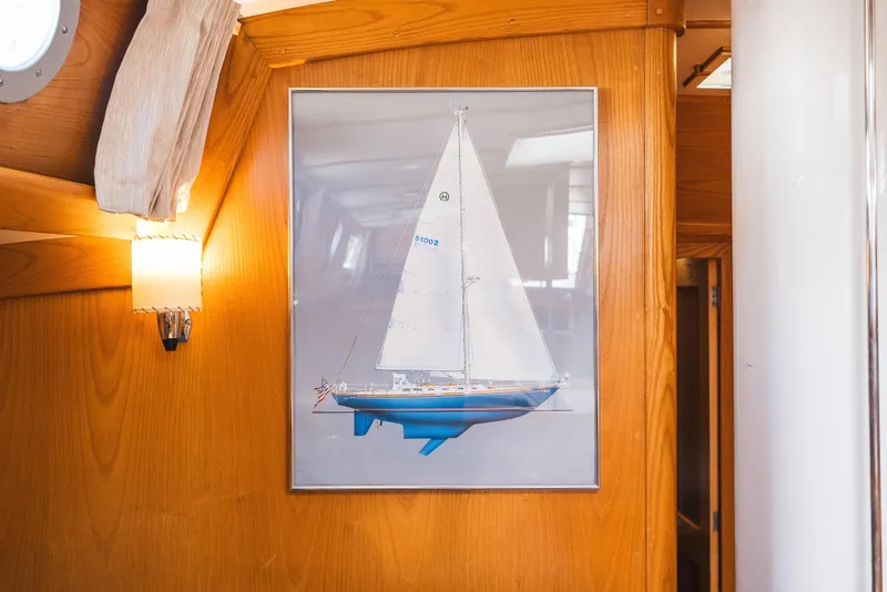 Slide: The Image of Framed sailboat illustration on wooden wall inside 1985 Hinckley Sou'wester 51 yacht. - 34