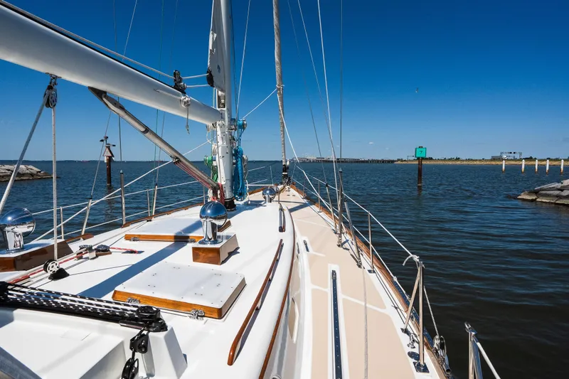 Slide: The Image of Hinckley Sou'wester 51 sailboat on calm waters, clear blue sky, 1985 model. - 39