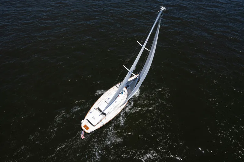 Slide: The Image of Aerial view of 1985 Hinckley Sou'wester 51 sailboat navigating open waters. - 65