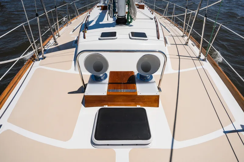 Slide: The Image of Hinckley Sou'wester 51 sailboat deck, 1985 model, featuring sleek design and polished wood accents. - 47