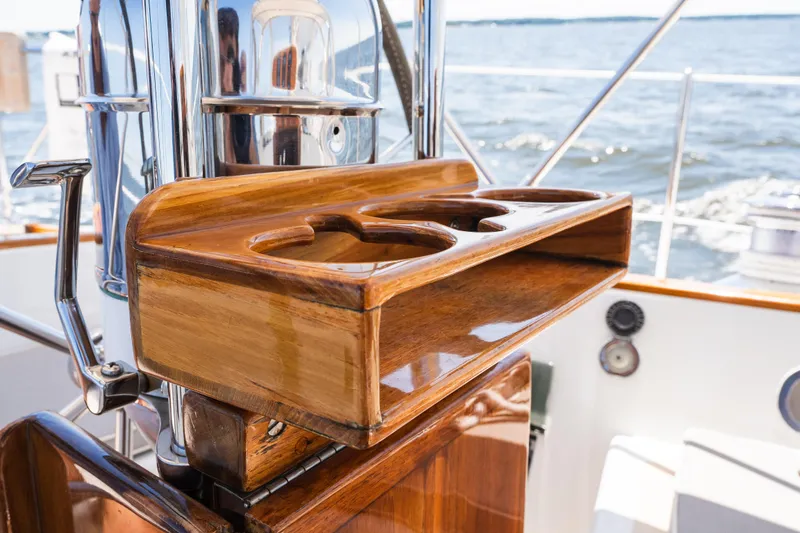 Slide: The Image of Polished wooden cup holder on 1985 Hinckley Sou'wester 51 yacht, with ocean view. - 60