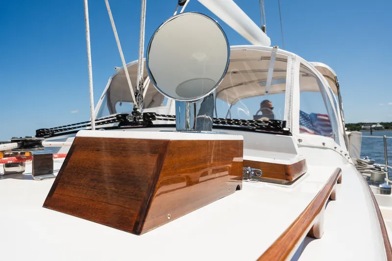 Slide: The Image of 1985 Hinckley Sou'wester 51 yacht deck with polished wood and nautical equipment. - 43