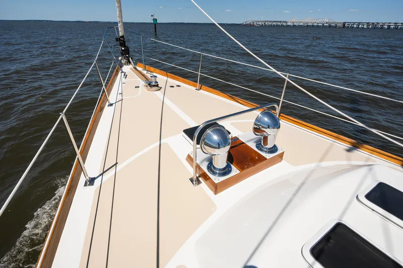 Slide: The Image of Hinckley Sou'wester 51 sailboat deck, 1985 model, cruising on open water with clear skies. - 45