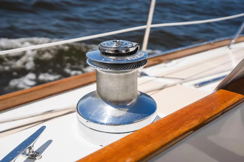 Slide: The Image of Winch on 1985 Hinckley Sou'wester 51 sailboat deck, with ocean in background. - 52