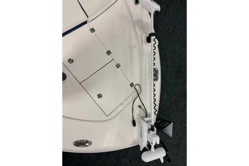 Slide: The Image of 2026 Robalo 246 Cayman boat deck with mounted equipment and storage compartments. - 12