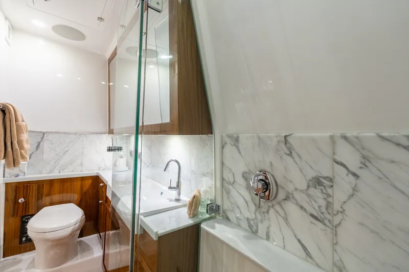 Slide: The Image of Luxurious bathroom in 2023 HCB 65 Estrella yacht with marble accents and modern fixtures. - 33