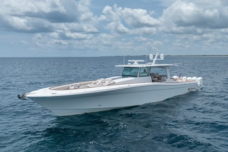 The Image of 2023 HCB 65 Estrella luxury yacht cruising on open ocean under cloudy sky. - 0