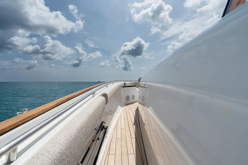 Slide: The Image of 2023 HCB 65 Estrella yacht deck with ocean view and cloudy sky. - 25