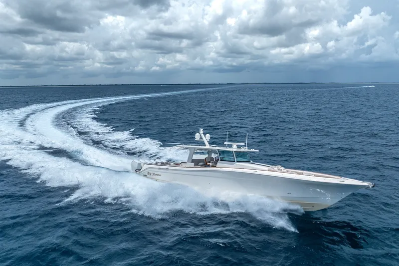 Slide: The Image of 2023 HCB 65 Estrella cruising on open ocean under cloudy skies. - 14