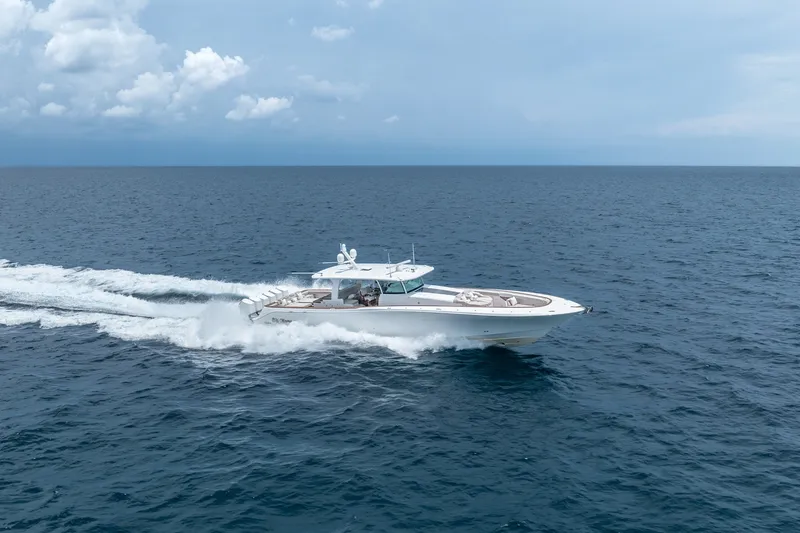Slide: The Image of 2023 HCB 65 Estrella cruising on open ocean under cloudy sky. - 15