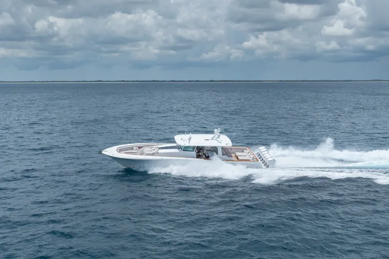 Slide: The Image of 2023 HCB 65 Estrella yacht cruising on open ocean under cloudy skies. - 18