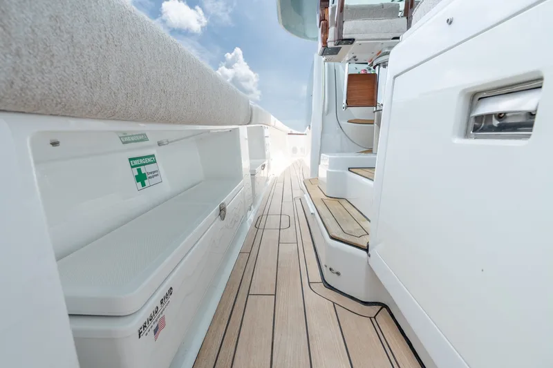 Slide: The Image of Luxurious deck of 2023 HCB 65 Estrella yacht with wooden flooring and emergency storage. - 43