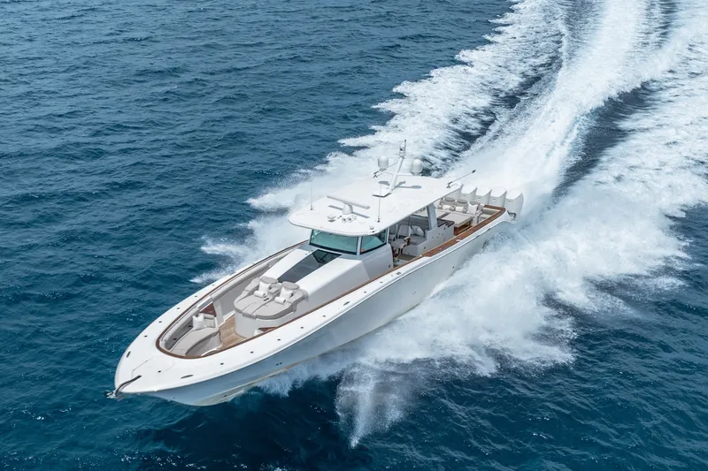 Slide: The Image of 2023 HCB 65 Estrella yacht cruising swiftly on open ocean waters. - 16