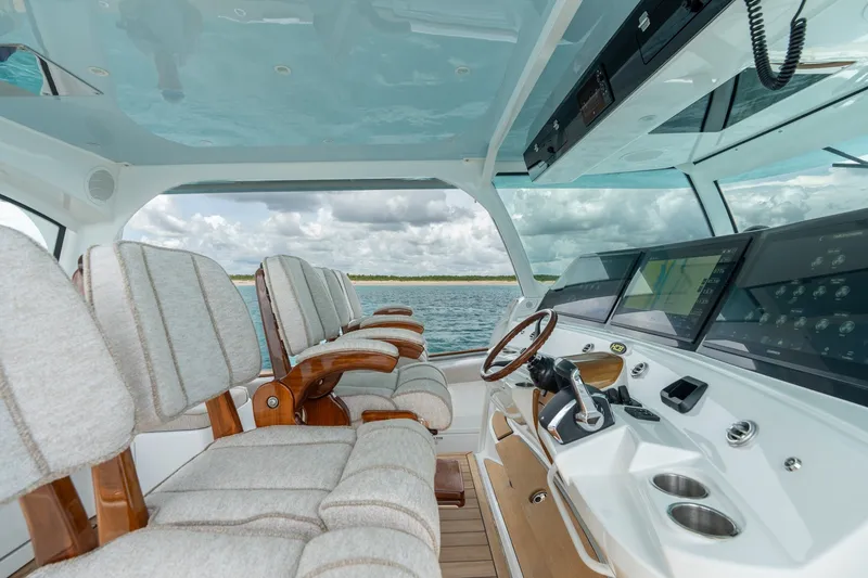 Slide: The Image of Luxurious interior of 2023 HCB 65 Estrella yacht with plush seating and advanced navigation controls. - 37