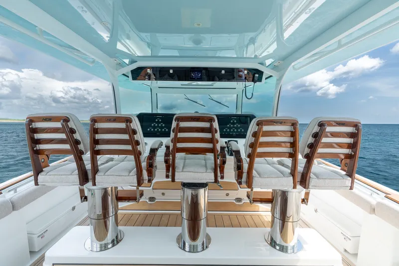 Slide: The Image of Luxury helm seating on 2023 HCB 65 Estrella yacht, overlooking ocean. - 35