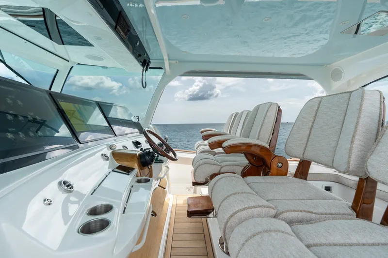 Slide: The Image of Luxurious interior of 2023 HCB 65 Estrella yacht with plush seating and ocean view. - 36