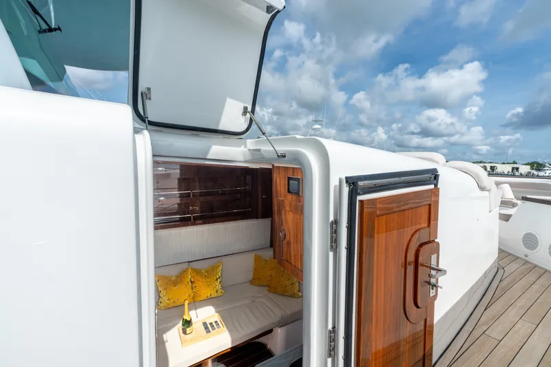 Slide: The Image of Luxurious interior of 2023 HCB 65 Estrella yacht with wooden accents and plush seating. - 27