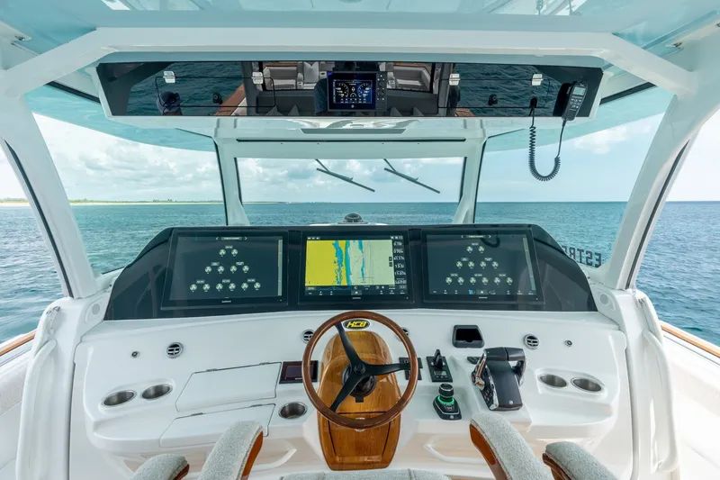 Slide: The Image of 2023 HCB 65 Estrella helm with advanced navigation displays on open sea. - 34