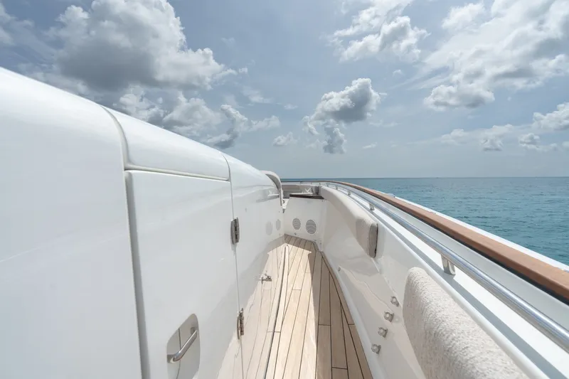 Slide: The Image of 2023 HCB 65 Estrella yacht deck with ocean view and cloudy sky. - 26